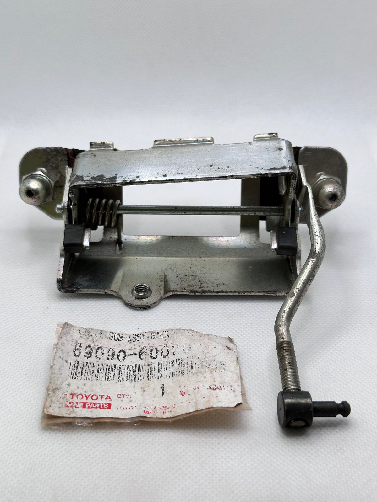 Toyota 69090-60020 Back-Door Handle Subassembly — Unused with Rust Marks